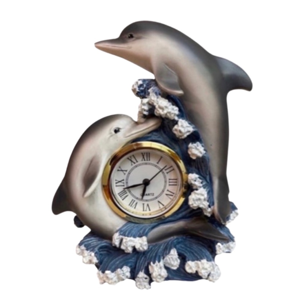 Two dancing dolphins encircle the clock amidst a spray of waves!